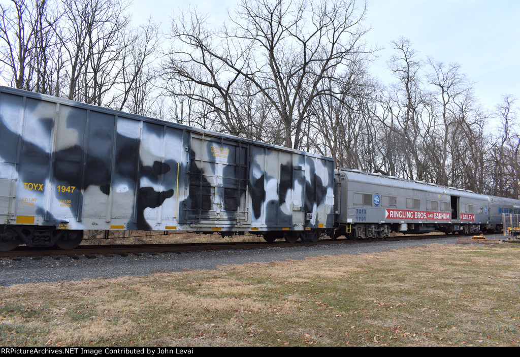 Camo boxcar on the M&NJ TFT train just north of the Boyd St Grade Crossing